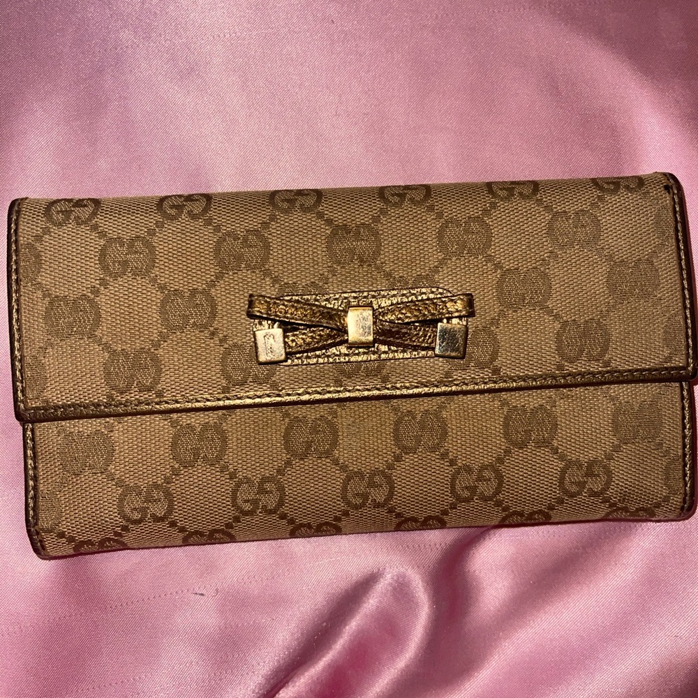 Gucci monogram trifold copper bow wallet